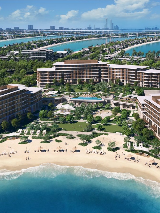 Palm Central Private Residences projesinin kumsal ve havuzlu havadan görünümü
